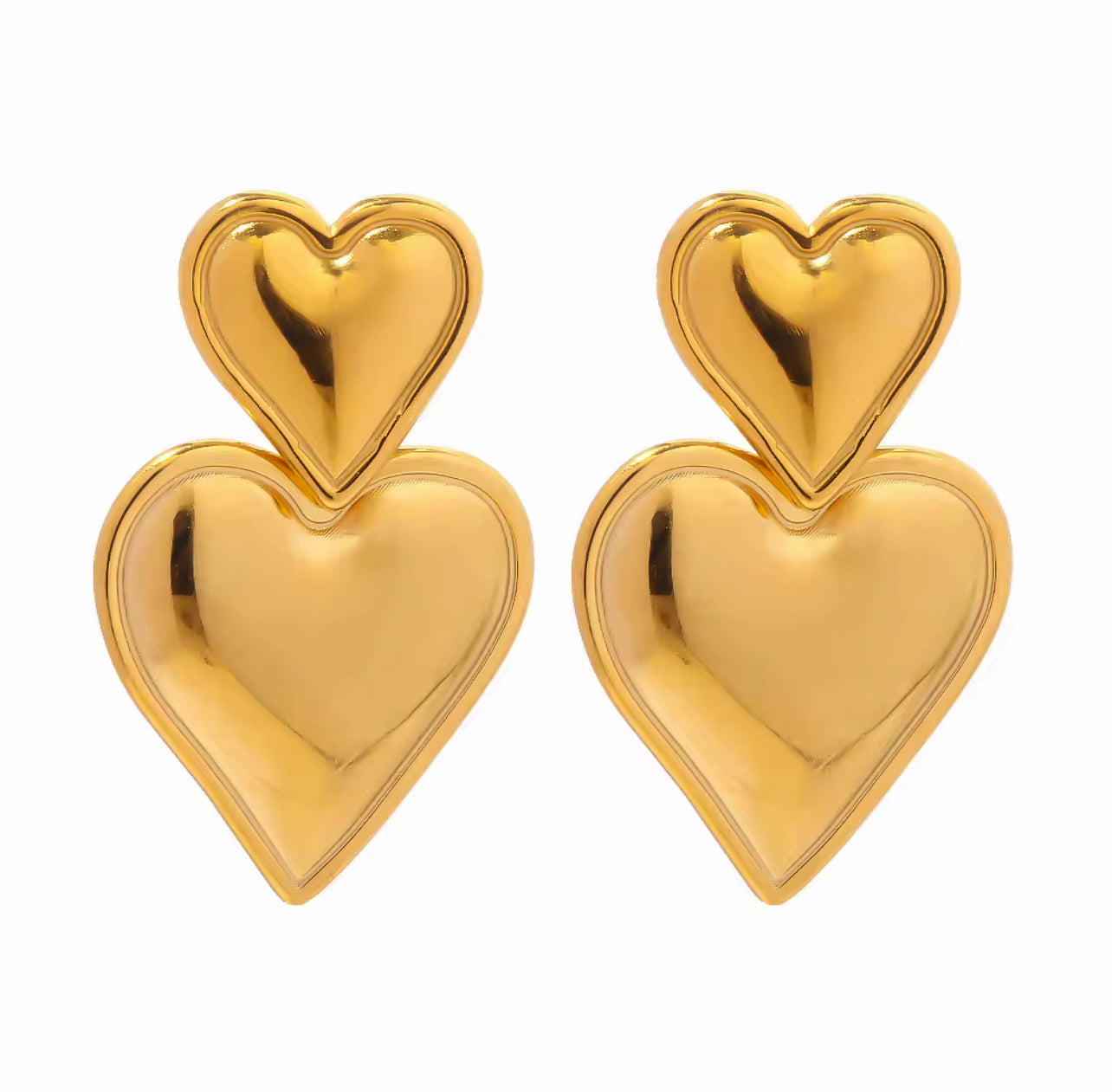 Pair of gold heart-shaped earrings on a white background